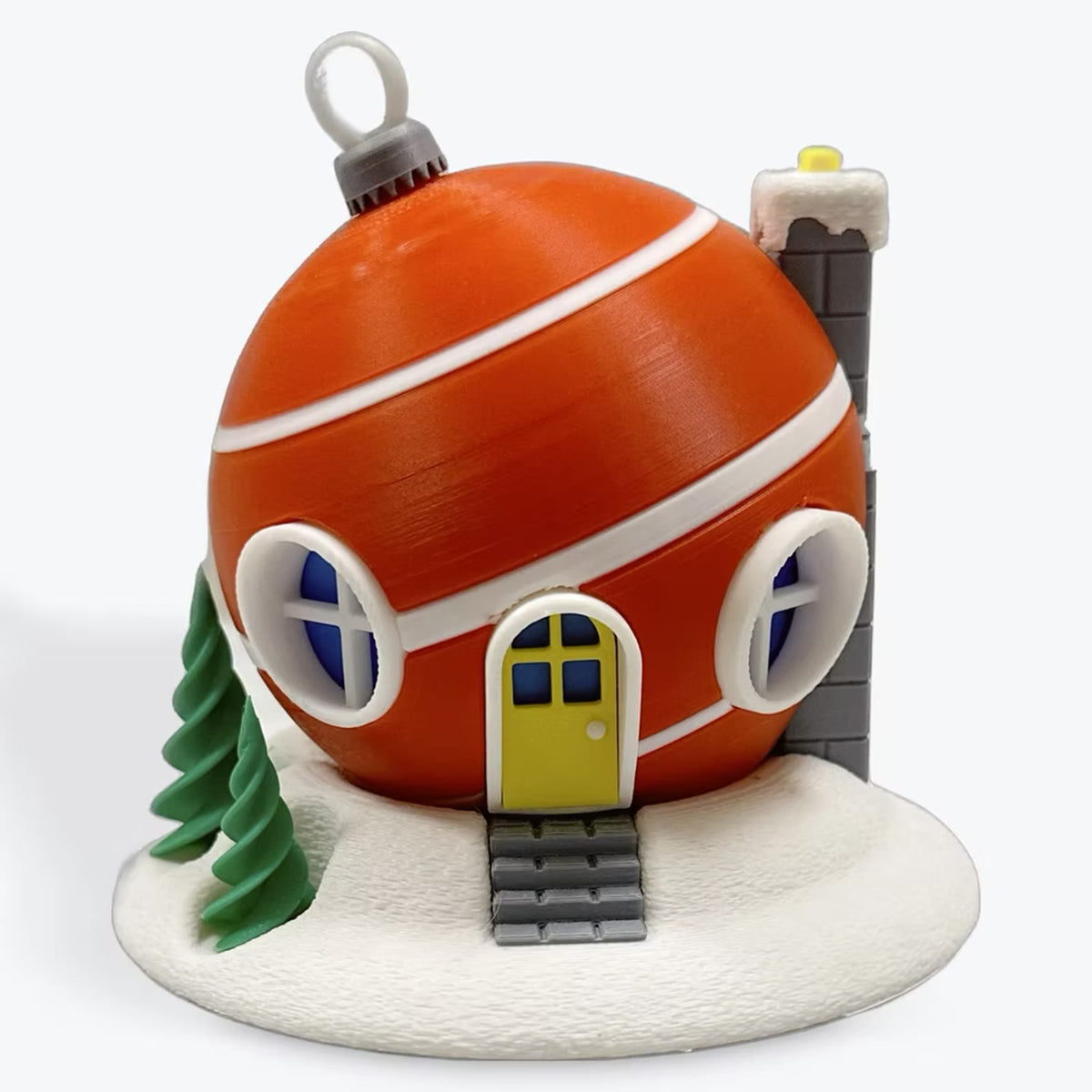 Orange bauble cottage with a yellow door and green tree