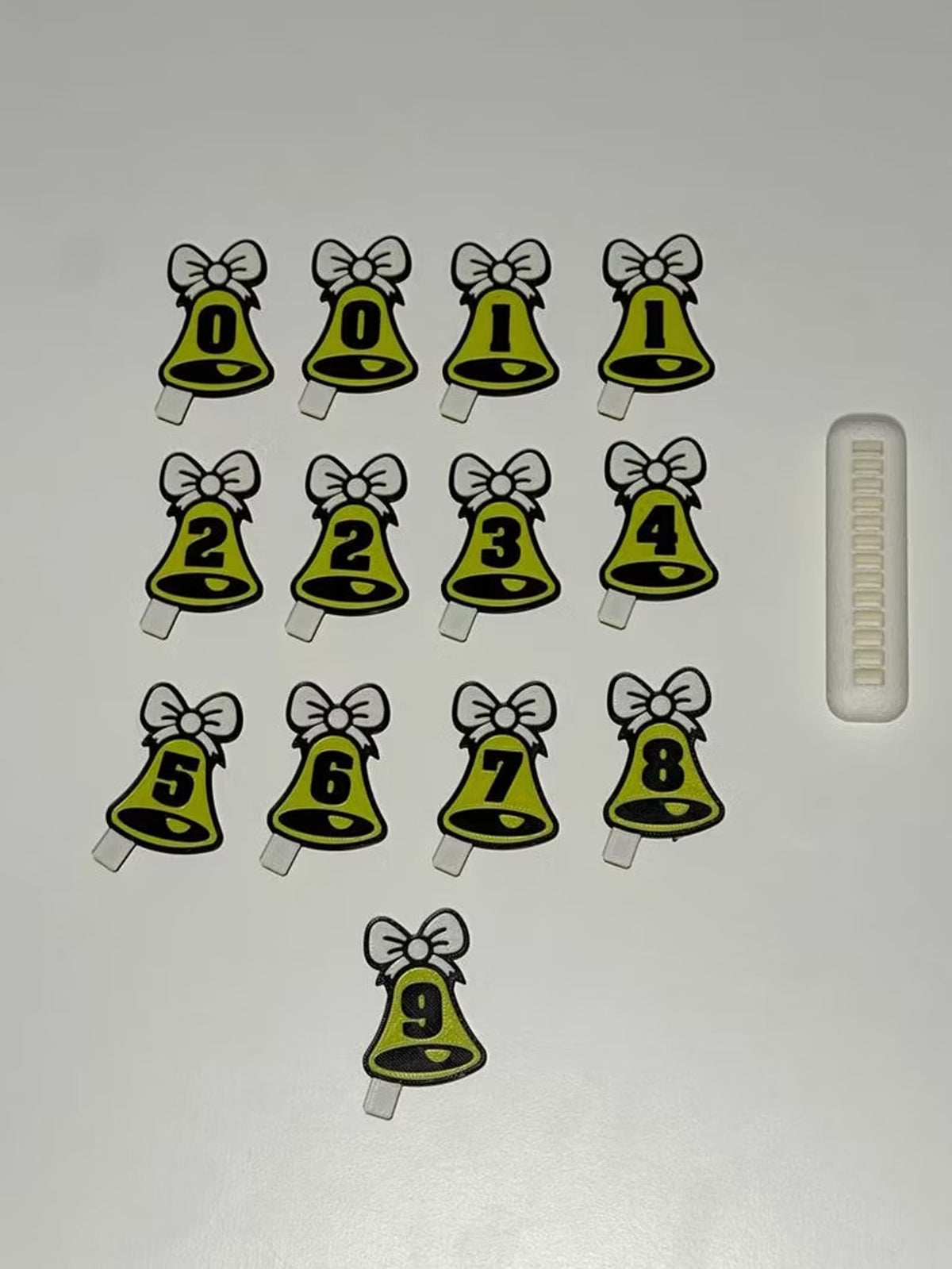 Interchangeable bell number tiles from 0 to 9