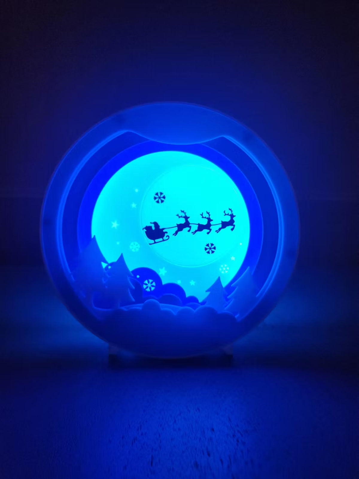 Sleigh night light glowing solid blue