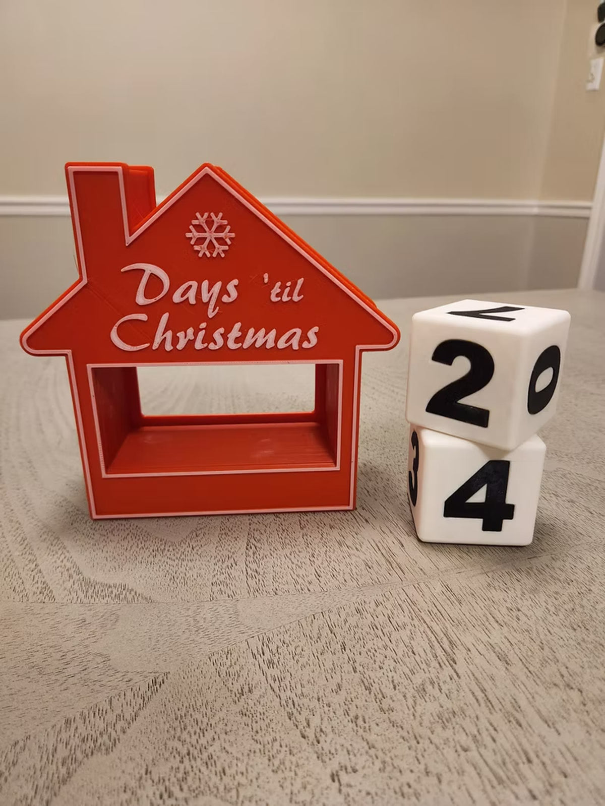 Number cubes stacked beside the house countdown