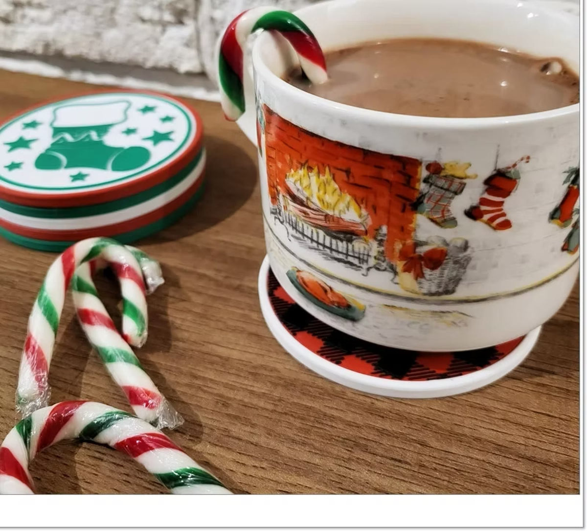 Buffalo plaid coaster under a mug of cocoa, with the rest of the set stacked nearby